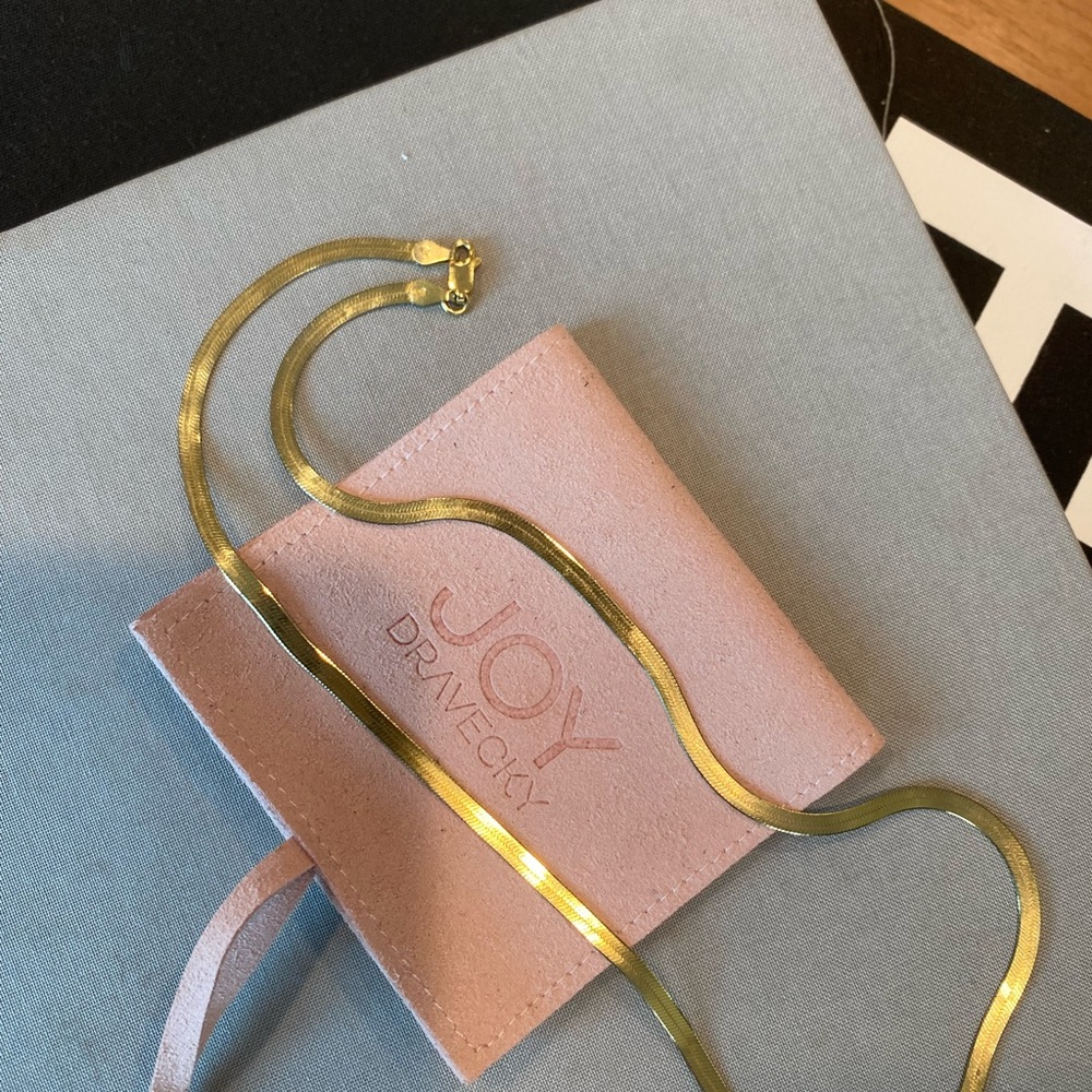 Joy Dravecky gold vermeil herringbone chain 16” with pink suede jewelry pouch.